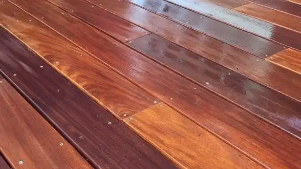 Close-up of fresh stain on cedar deck boards