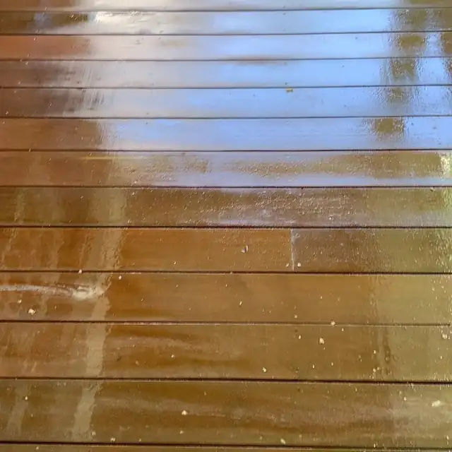Close-up of freshly sealed wet deck boards